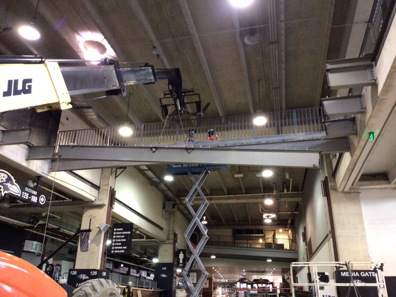 Cranes lowering beams at M&T Bank Stadium during renovations