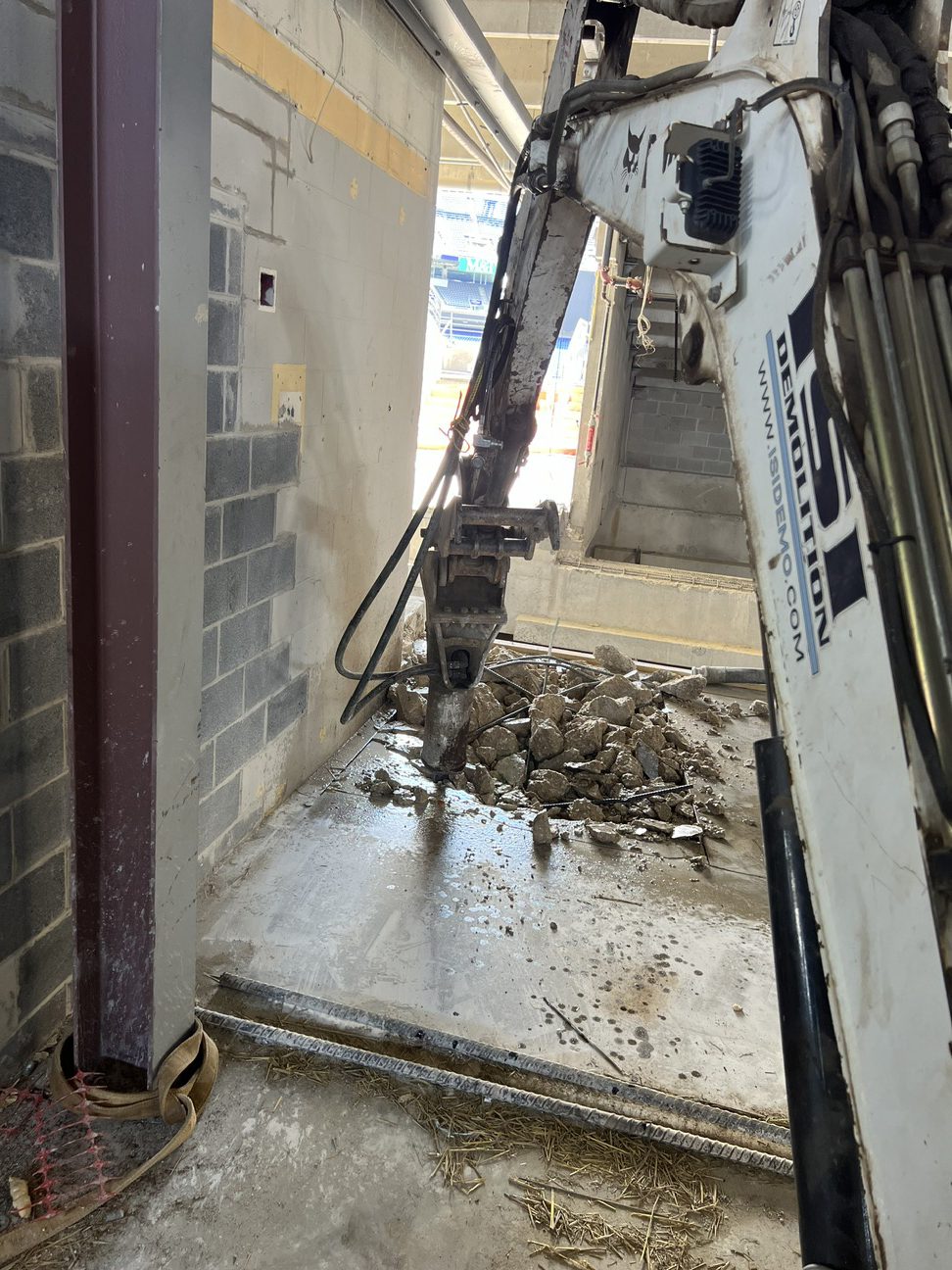 Interior Demolition ISI Demolition equipment breaking up concrete at M&T Bank Stadium