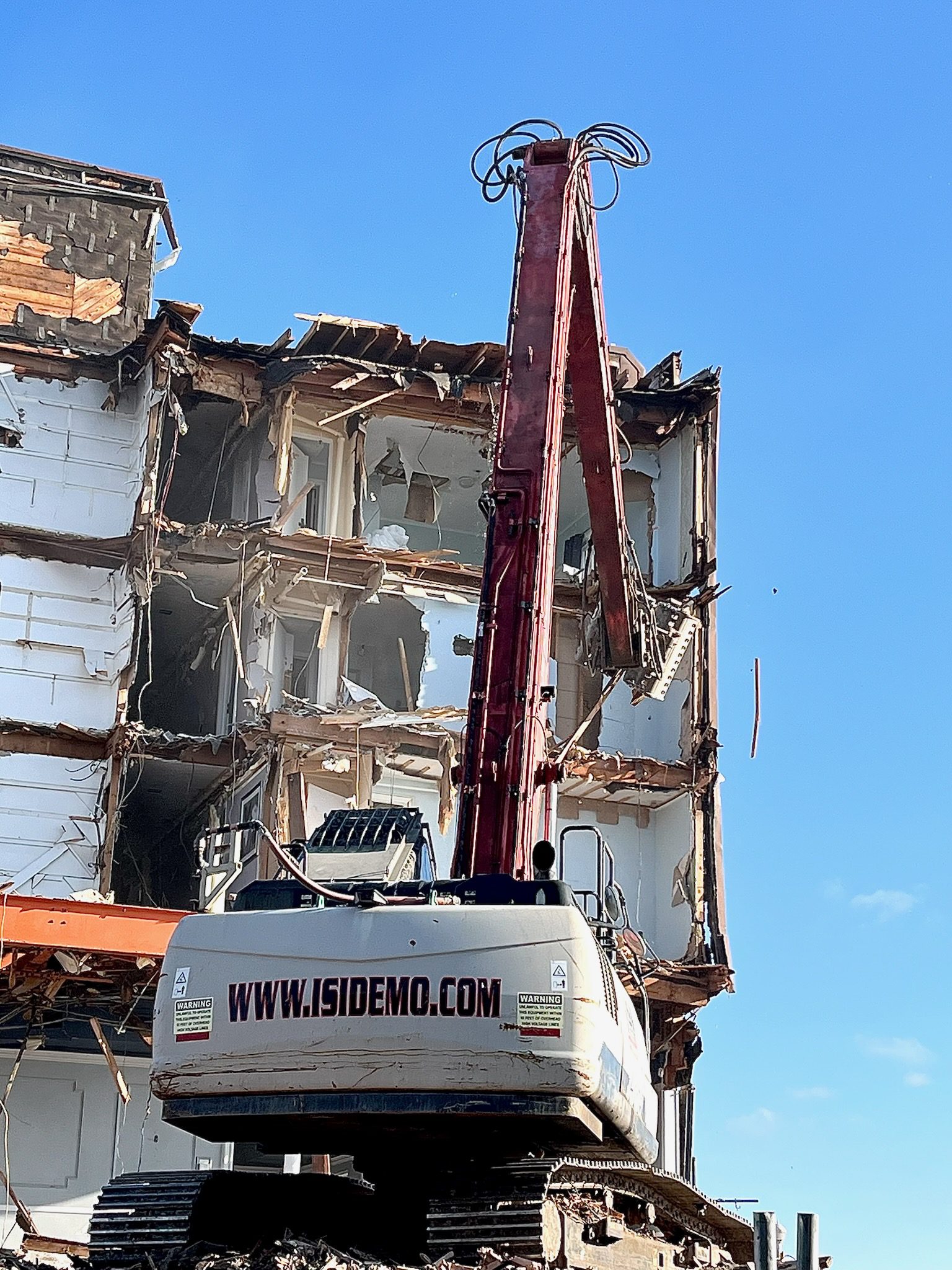 High Reach Excavator demolishing the Beach Plaza Hotel building in Ocean City, Maryland