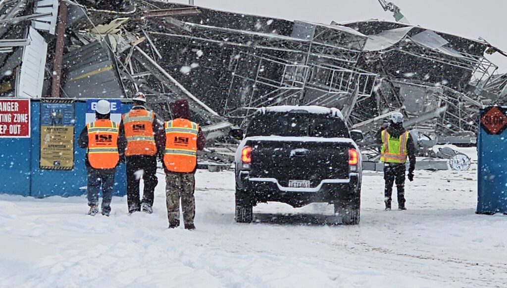 Team members walking to the demolition site