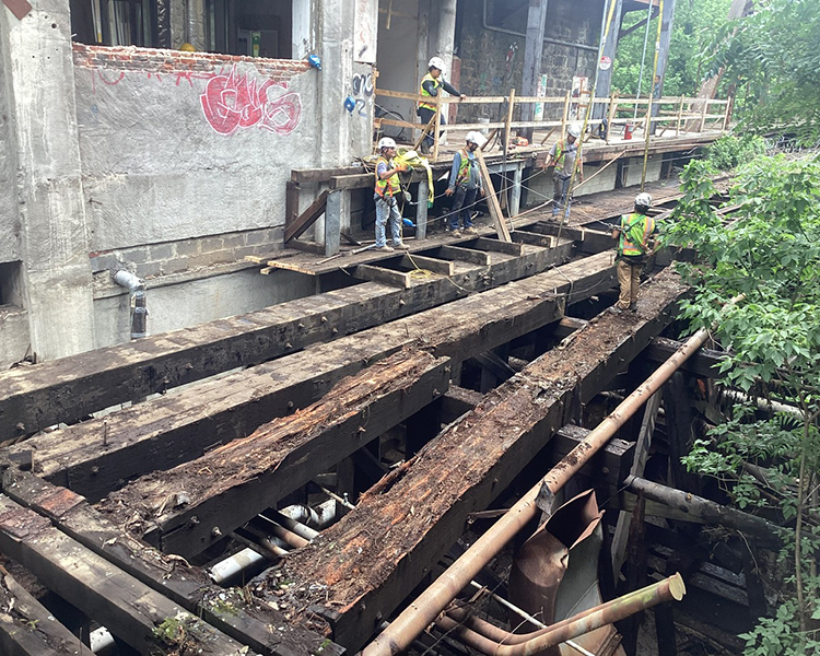 Exterior Beams Crews working on large beam removal during demolition