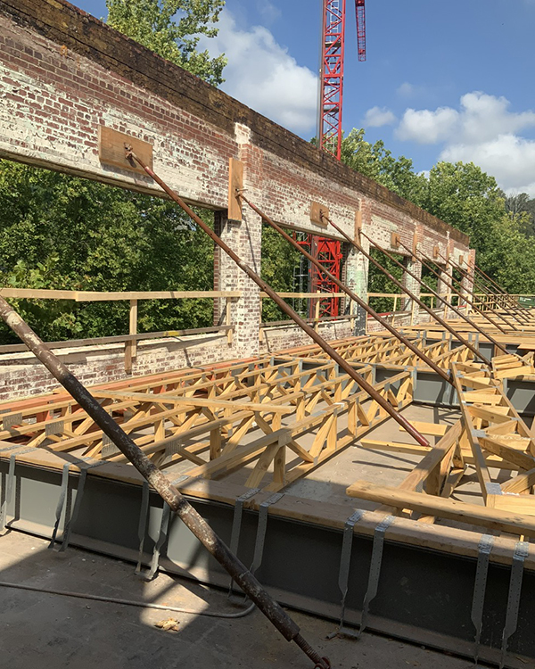 Shoring and bracing Shoring and Bracing used to secure the facade during the selective demolition of an old mill