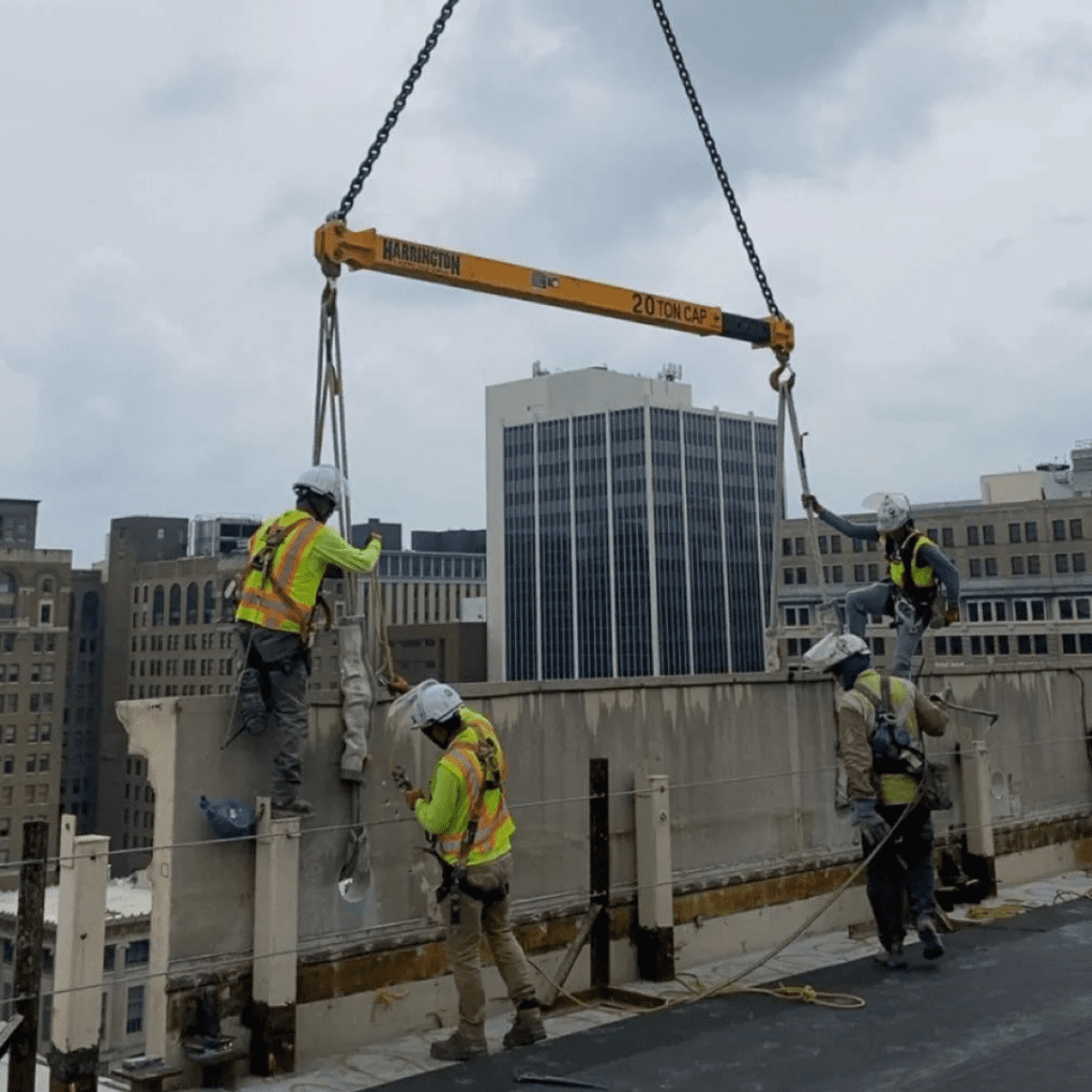 Crews rigging equipment during demolition