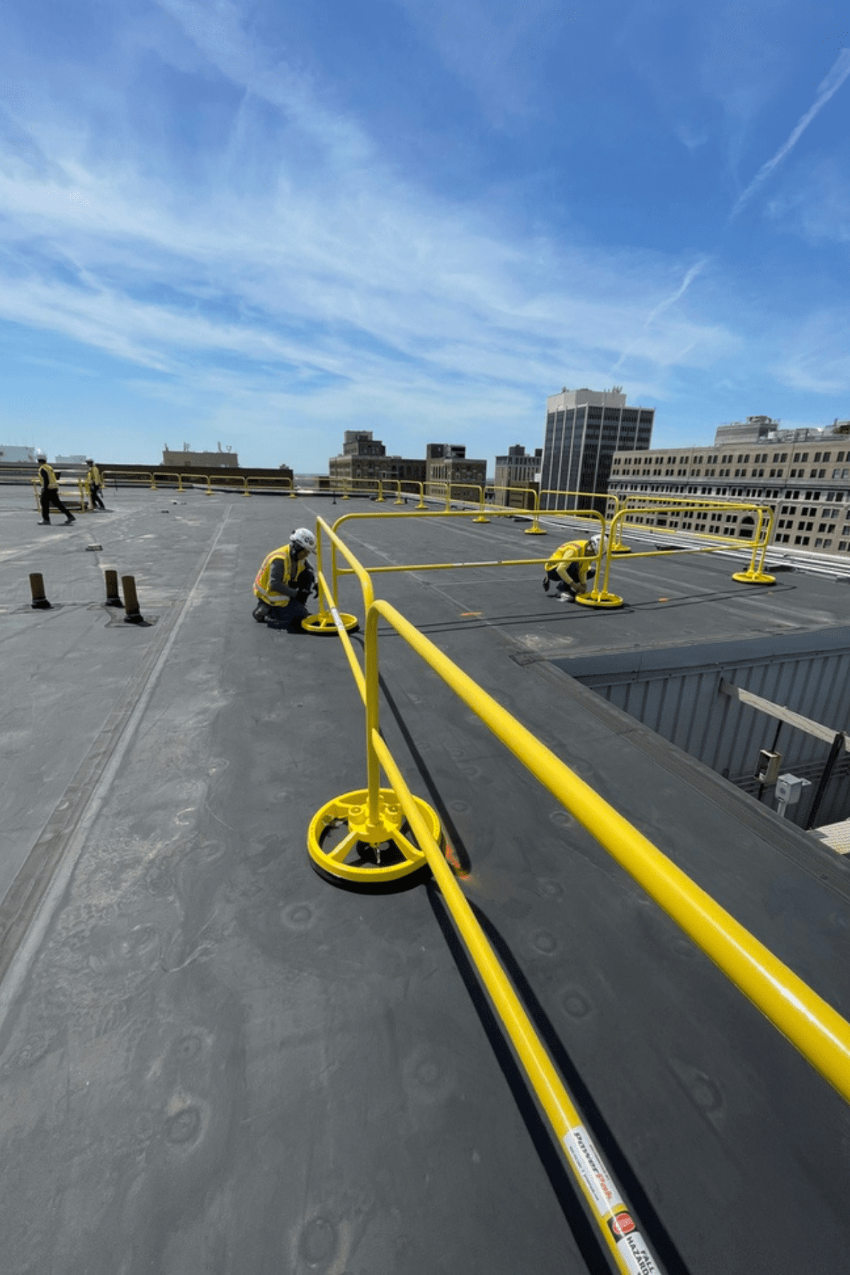 Guard rails being installed to keep crews off the leading edge