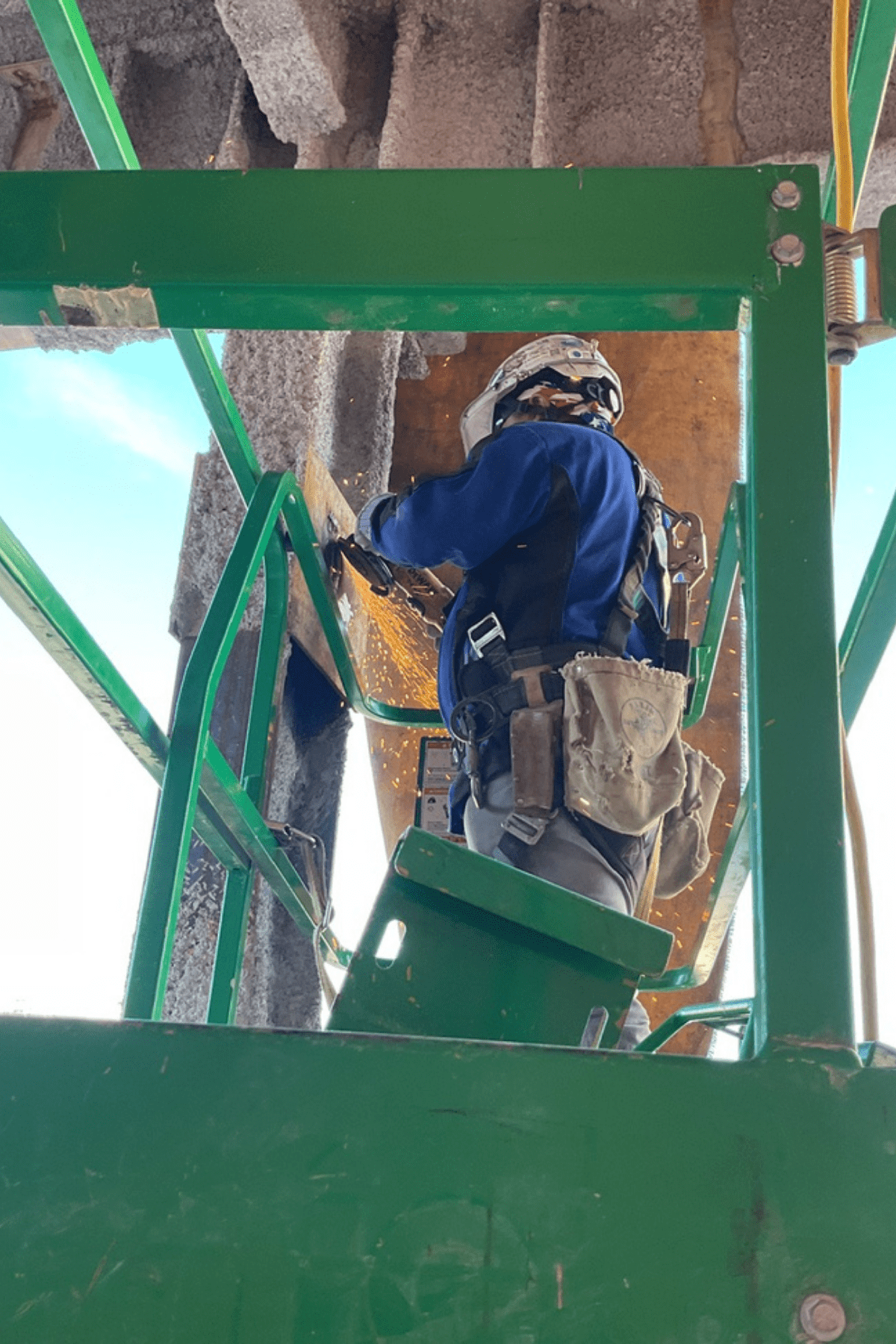 Demolition crew working on a green lift