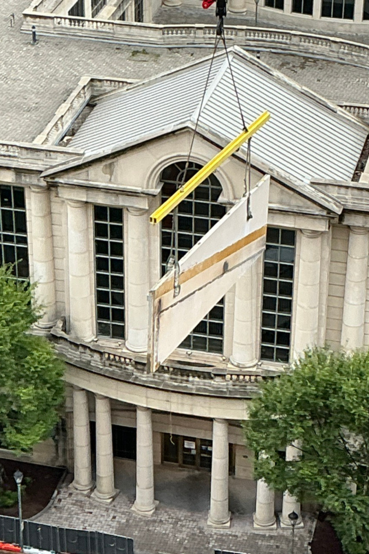 concrete panels being lowered during demolition