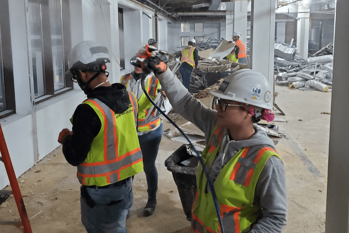 Demolition crews working together during demolition