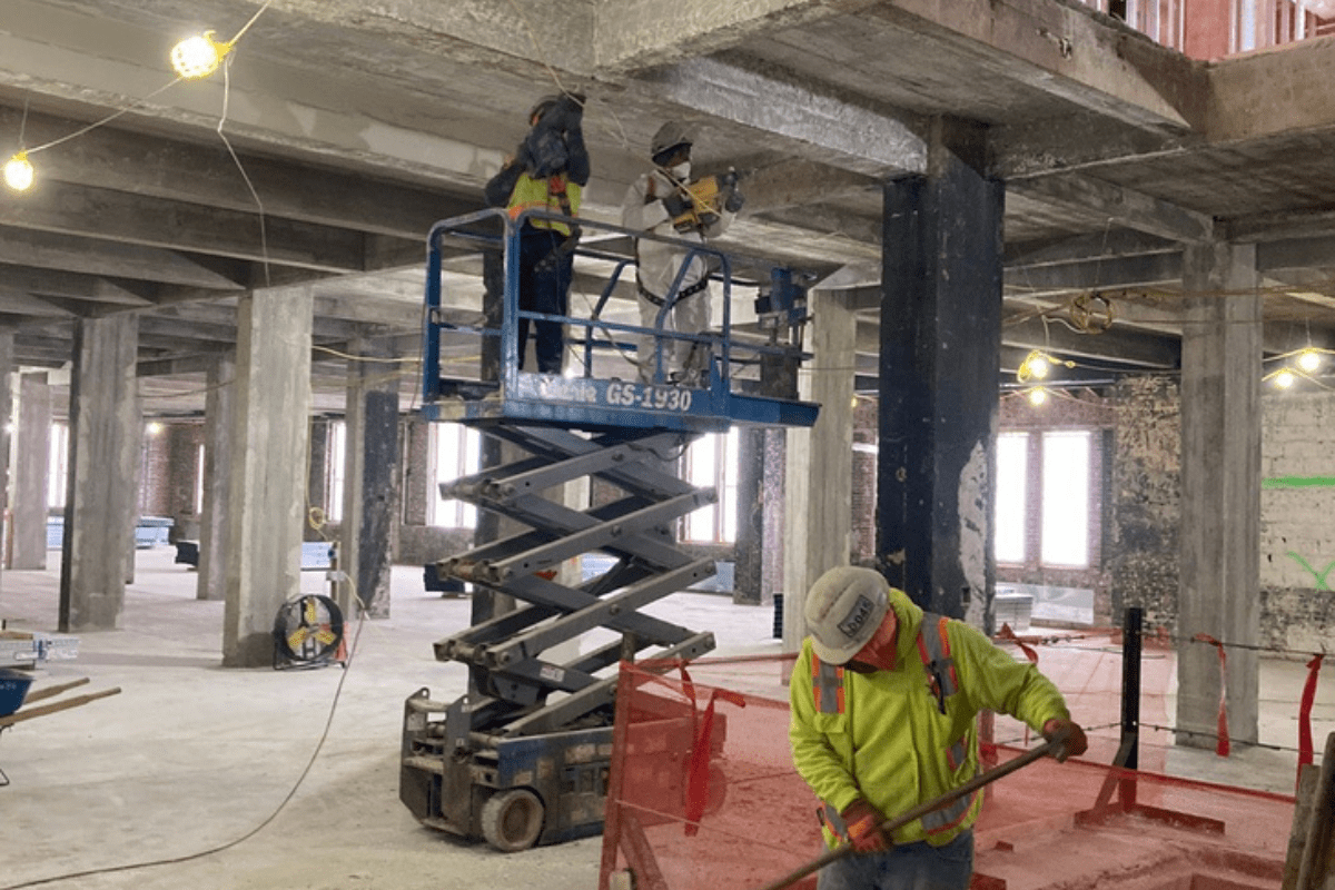 Crews working on a lift during demolition at a Baltimore City School