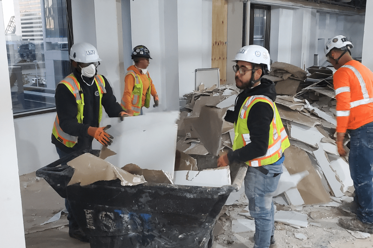 Crews handling interior demolition of an office building