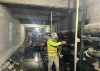 Crews working in the basement of Frederick Douglas during demolition