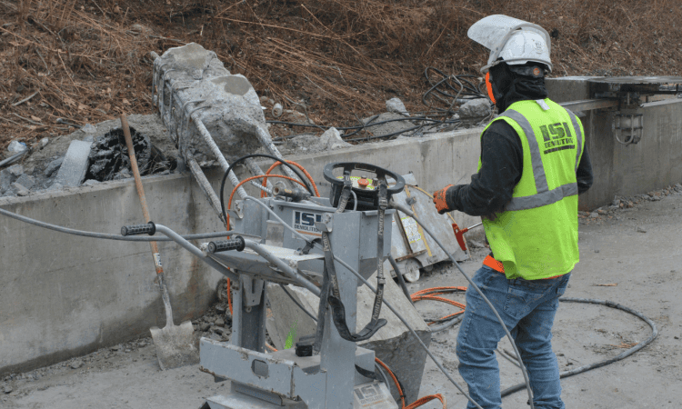 crews using specialized equipment to cut concrete