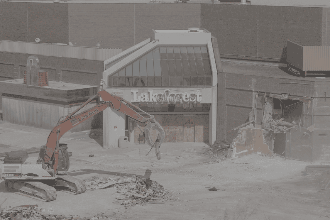 Excavator during mall entrance demolition