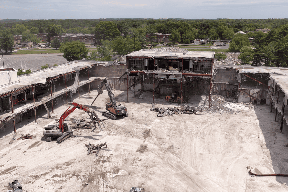 Excavator during mall entrance demolition